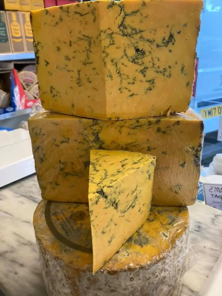 Stilton blue cheese stacked in wedges
